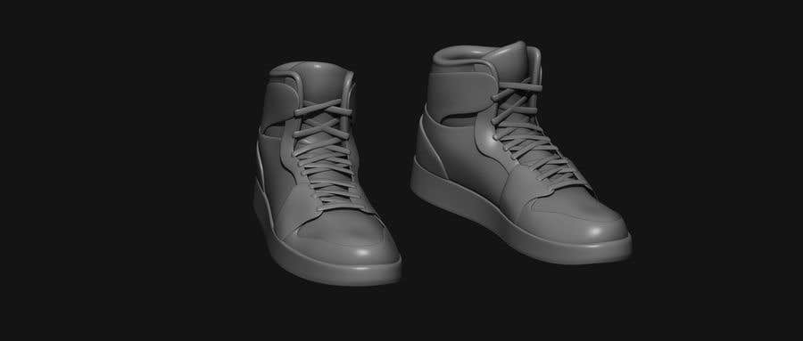 a pair of grey sneakers on a black background